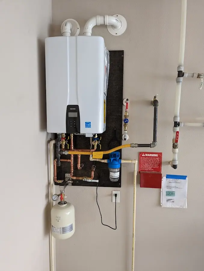 Professional plumber installing copper piping in a Laughlin home